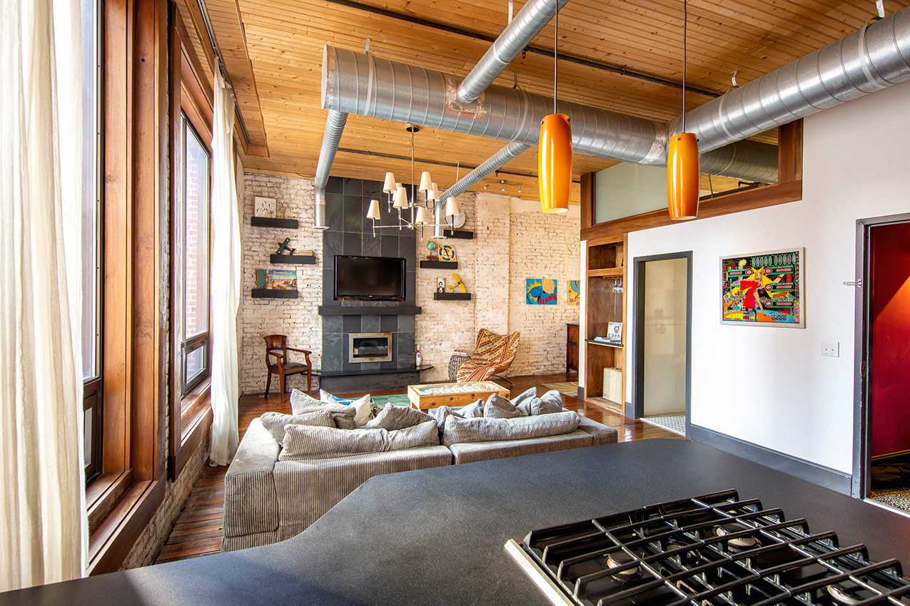 printers alley lofts flat loft living room kitchen fireplace